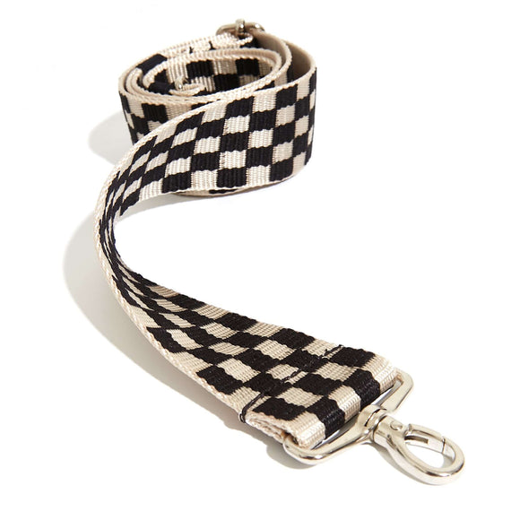 shortyLOVE boardwalk strap in black/white checker; front view rolled against white background.